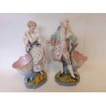 A pair of Dresden Large Figures, of a dandy and his female companion, each in coquettish poses,