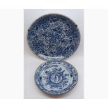 A Chinese Circular Charger, painted throughout in underglaze blue with an all-over floral panel