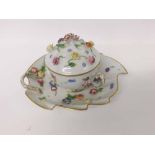 Late 20th Century Dresden double handled covered Cup and leaf shaped Saucer, decorated all over with