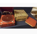 A Columbia table top Gramophone housed within a red leatherette case together with a matching red