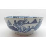 An Oriental Circular Bowl, painted in underglaze blue with an all over Chinese river scene, (rim