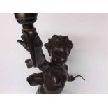 A Vintage Spelter large Table Lamp modelled as a winged putto, on a veined marble stand (knee