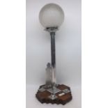 An Art Deco period chromium mounted Table Lamp with frosted globular shade, plain stem, joined by