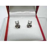 A pair of late 20th Century unmarked precious metal Stud Earrings, each of approximately 0,04ct