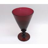 19th Century purple glass Goblet of tapering form, the knopped stem raised on a spreading circular