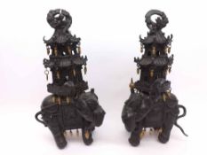 A pair of unusual Oriental Bronze Sensors modelled as elephants crested with pagodas, of sectional