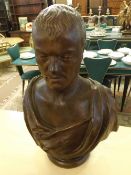 19th Century large plaster bust of a robed gent raised on a circular pedestal base, unsigned, approx
