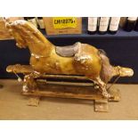 An early 20th Century traditional carved Rocking Horse mounted on Pine swing stand, height 37”,