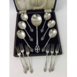 A cased set of six early 20th Century Electroplated Fruit Spoons and matching Serving Spoon, with