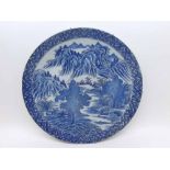 A Chinese Circular Plate printed in blue with a river scene, 12 ¼” diameter