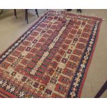 A Kilim Runner, decorated with parallel geometric designs, on a mainly red and blue field, circa