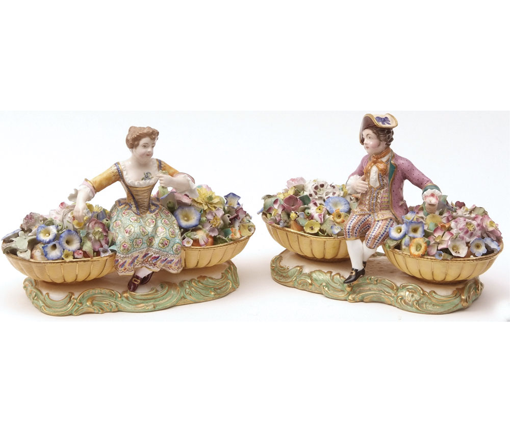 A pair of 19th Century English Figures modelled as seated male and female flower-sellers, each