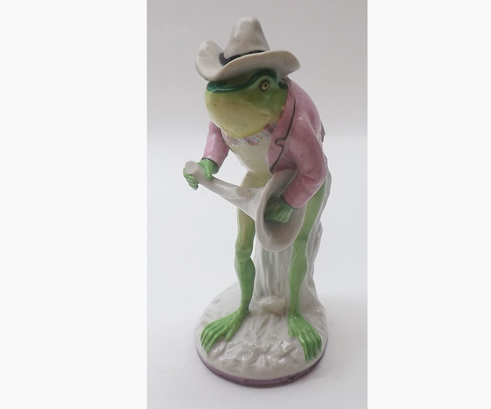 An unusual possibly French Frog Band Figure, (stem of horn etc missing), painted in colours, 5 ¾”