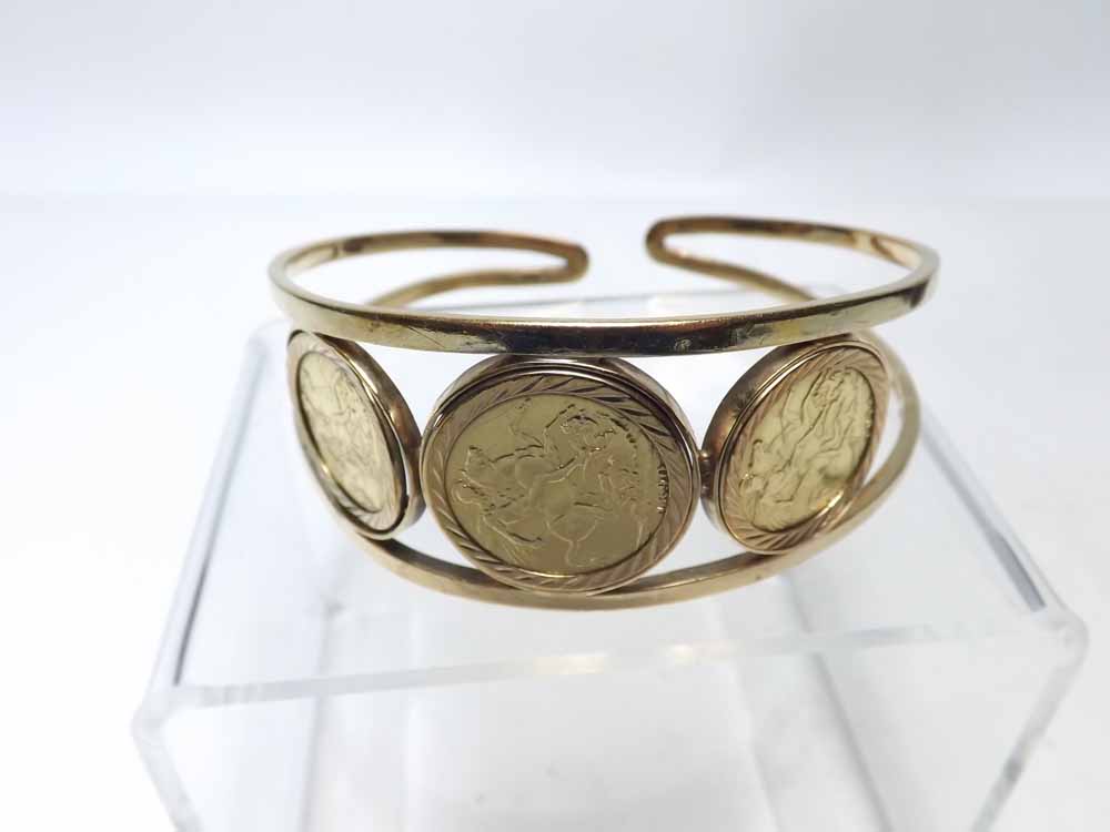 A late 20th Century hallmarked 9ct Gold Openwork Torc design Bangle, featuring a Victorian Gold