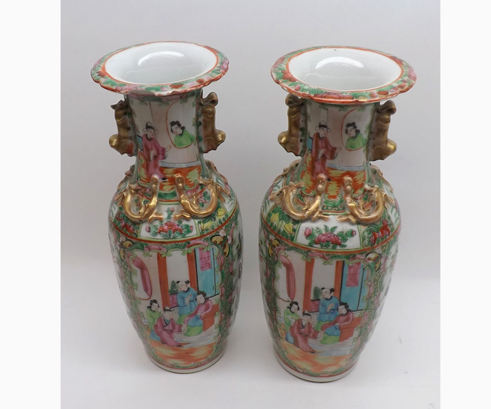 A pair of 19th Century Chinese Canton Vases, typically decorated with panels, various figures,