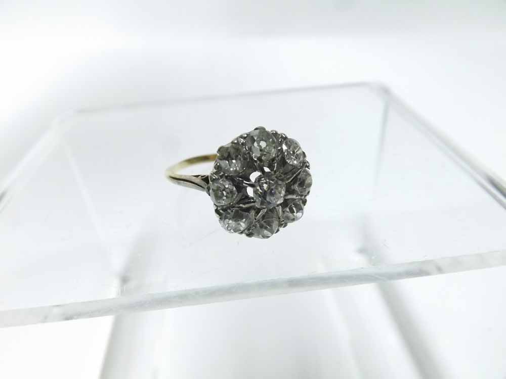 An early 20th Century 18ct Gold all Old Cut Diamond Set Cluster Ring of flower head design, approx