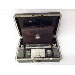 Mixed lot: comprising a travelling part-Vanity Set, the case containing six Silver plated topped