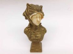 A small Bronze and Ivory-faced Bust of a young veiled lady, raised on a tapering plinth base, signed