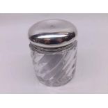 A Baccarat Moulded Glass Dressing Table Jar with wrythen fluted decoration, detachable plain