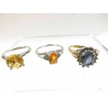 Two hallmarked 9ct White Gold Dress Rings, each set with orange stone and a further unmarked