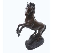 Reproduction Bronzed finish model of a Rearing Horse on naturalistic plinth base, 14 ½” high