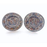 A pair of 19th Century Chinese circular dishes, decorated in blues, reds and gilt highlights with