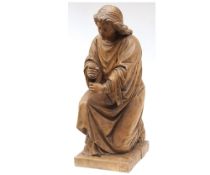 Carved 19th Century fruitwood model of a kneeling cloaked figure raised on a rectangular plinth