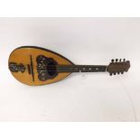 An early 20th Century bowl-back eight-string Mandolin with case
