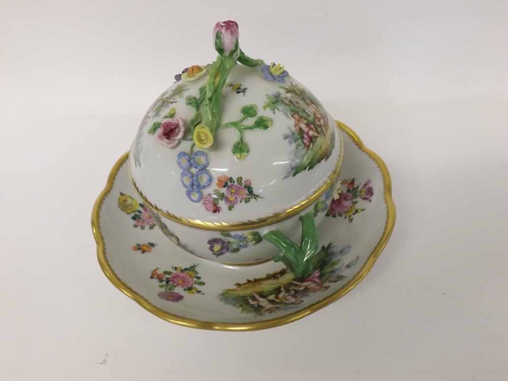 Late 20th Century Dresden covered Cup and Saucer, the cover with looped twig handle over body with