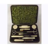 An early 20th Century cased Manicure Set to include scissors, buffers, files etc