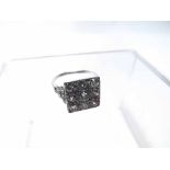 An unmarked precious metal Cluster Ring, square shaped, featuring nine pavé set old cut Diamonds,