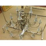 A large three-tier 21 light Dutch style Electrolier, the metal body with burnished finish an