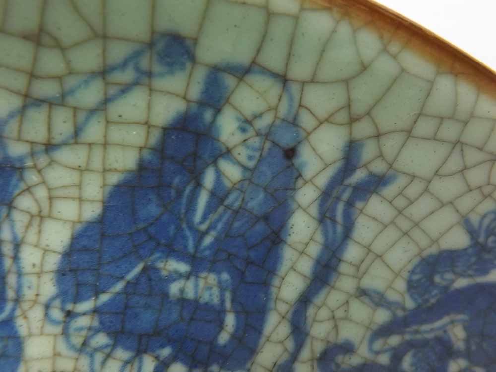 A 20th Century Oriental Circular Plate, decorated in underglaze blue with figures on a crackle glaze - Image 5 of 6