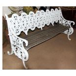 A Victorian Coalbrookdale white painted cast iron Garden Seat with pierced and arcaded back, each