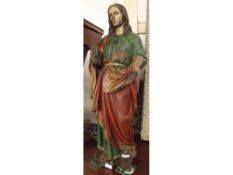 18th Century carved wooden painted model of a saint in flowing red, green and gilt highlighted