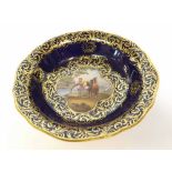 A Meissen small circular Dish with shaped rim, the centre painted in colours with scene of mounted