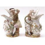 A pair of Meissen Groups of young man and woman, each seated beside large flower-encrusted ewers