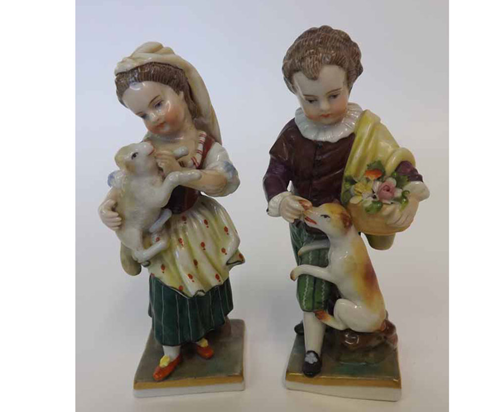 A pair of small 20th Century Dresden Figures of young girl and boy with a cat and dog