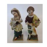 A pair of small 20th Century Dresden Figures of young girl and boy with a cat and dog