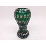 An iridescent overlaid Glass Vase of tulip baluster form in the Loetz manner, decorated