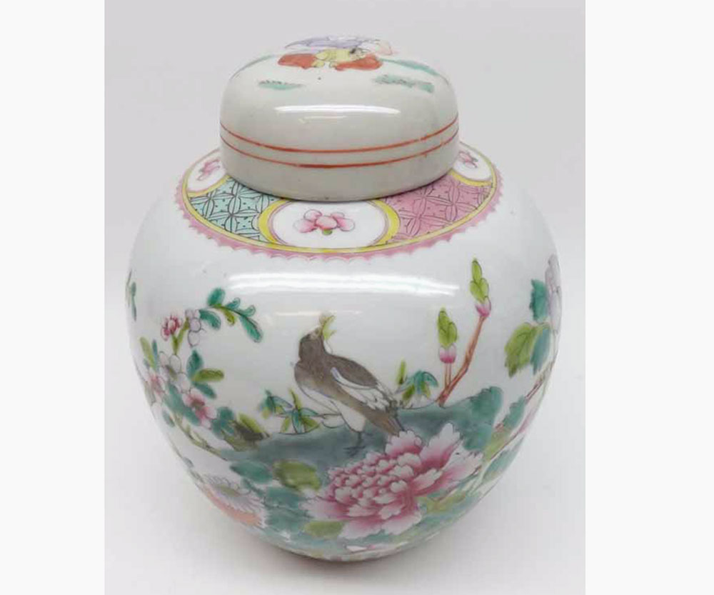A Chinese Ginger Jar decorated in famille verte and rose with birds in foliage below a