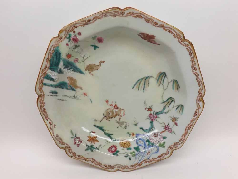 A Chinese Octagonal Dish, painted in colours with animals and flowering foliage etc (restored),