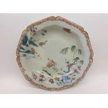 A Chinese Octagonal Dish, painted in colours with animals and flowering foliage etc (restored),