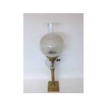 A Brass Corinthian Column Oil Lamp, later globular opaque shade and clear glass font, 27” high