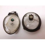 An unusual glass Pendant of oval form, applied in the centre with green glass stone and with