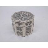 Chinese white metal box of octagonal form fitted with hinged lid, the body decorated with panels