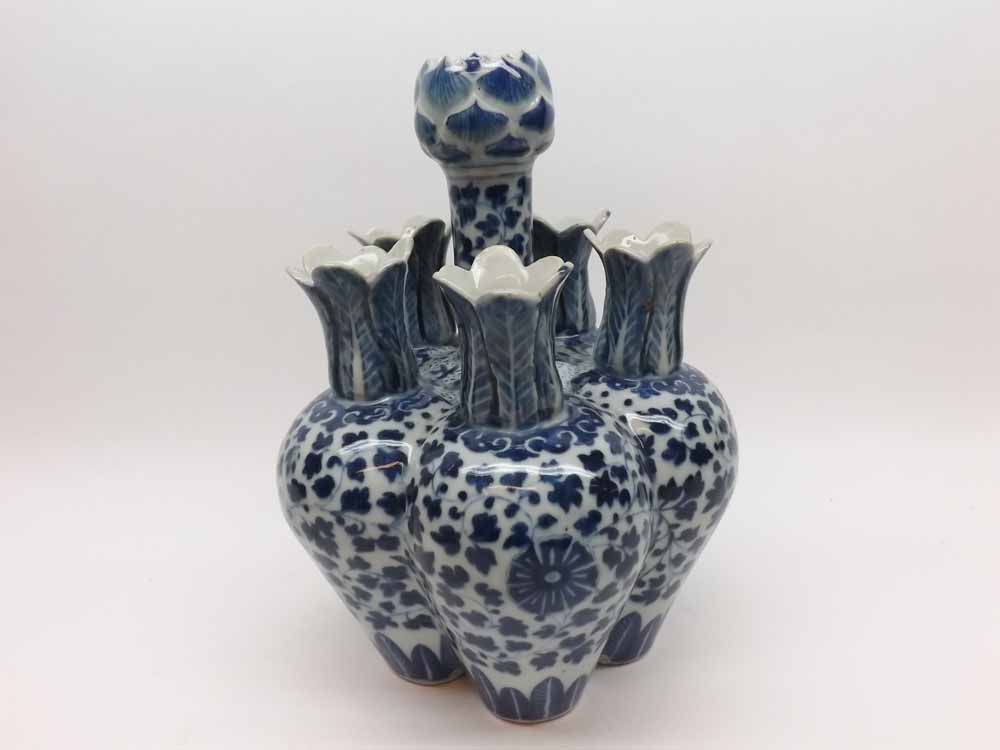 An Oriental Posy Vase of lobed baluster form, decorated throughout in underglaze blue with twining