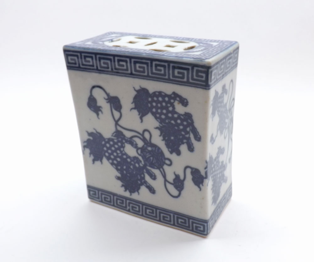 A Chinese Flower Brick, pierced top, body decorated with panels of Kaolin within keyhole borders, in