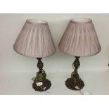 A pair of reproduction bronze effect Table Lamps with foliate moulded stems and similar spreading