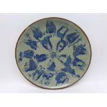 A 20th Century Oriental Circular Plate, decorated in underglaze blue with figures on a crackle glaze